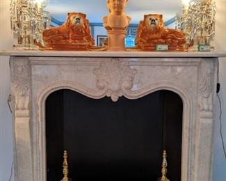 Italian Carrera marble fireplace surround, pair of vintage cut crystal lusters, pair of vintage porcelain lions, by Sadler, of  Burslem, England, terra cotta bust and VA Metalcrafters brass andirons.