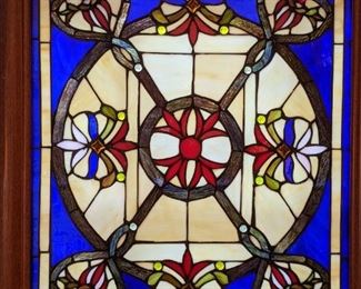 Close-up of one of the pair of stained glass window panels in the living room; measures 21" wide x 27" tall.