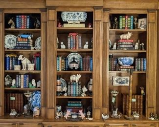 Wonderful wooden bookshelf, w/Asian porcelains, English china, vintage cast iron toy collection, leather bound Reader's Digest condensed books and pair of vintage brass gryphon table lamps, w/stained glass shades. 