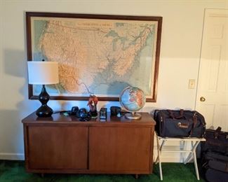 Ah, another Aero Service Corporation 3-D map, this one of the US, a vintage office credenza, globe and gourd-y looking table lamp. Bonus, a complete set of vintage American Tourister luggage to style and profile as you board that Eastern or TWA flight to Europe.