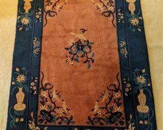 Vintage Chinese Deco hand-woven wool rug, measuring 4' 2" x 6' 4".