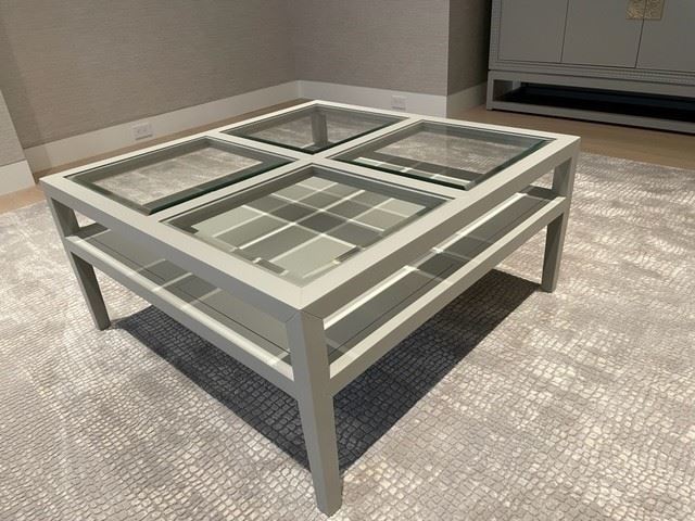 $400 - Large 40" Square Four Section Beveled Glass/Gray Composite Coffee Table GM38-10591            Description : The 40-inch square cocktail table handsomely combines style and function. The top is made of four beveled glass inserts that rest in a grey lacquered frame; the open shelf underneath can be used to display treasured books and collectibles. Beautifully proportioned with architectural lines, all perfectly dressed in a lacquered grey frame with a four section tempered, beveled glass top.

Condition Desc. : Piece has been well cared for and is in very good used condition. Please refer to photo's for a more detailed look at condition. We make every attempt to list and photograph any defects or signs of wear that are significant to this sale.

Local Pick up Germantown, MD.  Contact us for shipper suggestions.

Width : 40"
Depth : 40"
Height : 19"