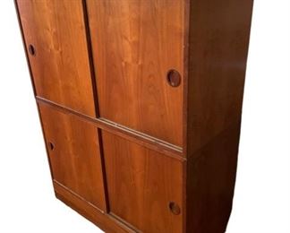 $1500 - 2 Hansen & Guldborg Hg Danish Mid Century Sliding Stackable Cabinets JB59-1                                                                         Set of 2.  Vintage modern sliding door cabinet in Rosewood. Features adjustable shelves. This vintage mid century modern Hansen & Guldborg wall-mounted cabinet, floating shelf or media console made in Denmark circa 1965 has a classic Danish modern design with clean, minimalist lines. Well constructed from rosewood the cabinet features beautiful sculpted wood cabinet pulls, solid brass hardware and two interior compartments each with one adjustable and removable shelf. Cabinet has finished interior and underside. Manufacturer's mark to reverse that reads 'HG Furniture Made in Denmark'. Includes a base for floor standing                               DIMENSIONS: 35"L x 15.75"D x 44"H