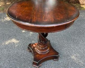 $75 - Round Hand Carved Wood Table with Twisted Pedestal Base CG97-25                                                                             This round end table is made from solid wood, with a hand-carved design that highlights the natural wood grains and imperfections for a rustic look. It has a pedestal base with turned detailing and an open, twisting carved design that's complemented by the clean-lined tabletop. This accent table looks just right next to your favorite living room armchair, or even serving as a console table in the entryway. There's plenty of room on its 30" diameter surface for a vase of flowers, a framed family photo or two, or an accent lamp.

Width : 30
Height : 29.5

Good Condition.  Shows signs of wear.

LOCAL PICK UP POTOMAC, MD. SHIPPING SUGGESTIONS AVAILABLE UPON REQUEST.