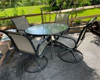 $100 - Shae Design Round Table and 4 Swivel/Rock Chairs CG97-32                                                                                          Patio set includes frosted glass round table with center hole for umbrella access and 4 swivel chairs. Bronze colored frame with a tan mesh seats for a perfect neutral set!

Table 41 x 27H Chairs 23 x 24 x 35H

Width : 41
Height : 27