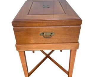 $50 - Side Table Silver Chest Cabinet / End Table CG97-28                                                                                                                          An antique Traditional style silver chest on stand, unbranded. The silver chest that rests on the lower stand. Lockable, the chest lid lifts open on hinges to reveal it's felt lined silverware organizers. The silver chest lock is untested as no key present. The stand is sturdy with crossbar bracing and tapered legs. Likely made in the USA, in the late 19th Century.

Monogrammed with letter "G"

Length : 18
Width : 15
Height : 24

Local pickup Potomac, MD.  Contact us for shipper suggestions.