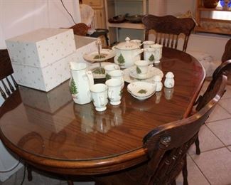 oak dining table, five press-back chairs. tempered glass top.