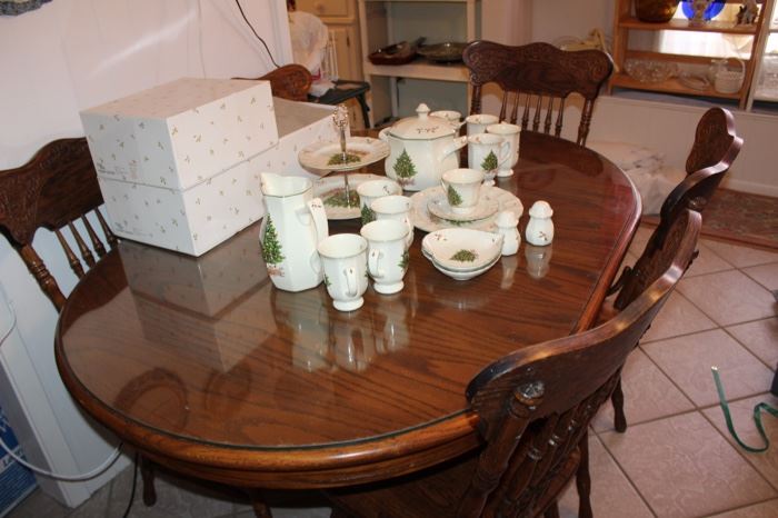 oak dining table, five press-back chairs. tempered glass top.