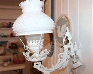 iron wall sconce and electric lamp