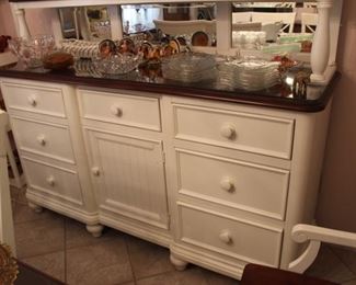"Kathy Ireland" designer buffet with seven drawers cabinet, beveled mirrors back, top shelf. matches dining table.