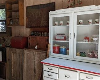 Hooser cabinets were the earliest compartmentalized workstation kitchens. With flour sifters canisters and pull out counter.