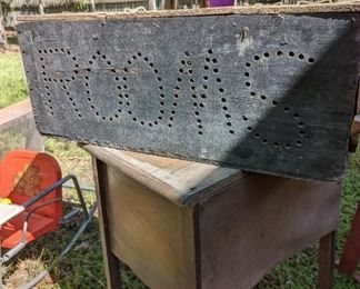 Okay this is a funnest piece ever. It is a box and it has holes drilled into it to say rooms on both sides. So you'd put your light in it and advertise that you had rooms for rent.