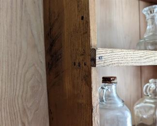 The sweet little early oak hanging shelf was found in the rafters. You can see the quartersawn marks on the sides.