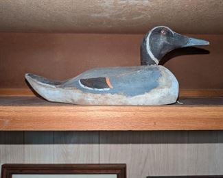 The decoy is signed. There is slight damage to one eye socket.