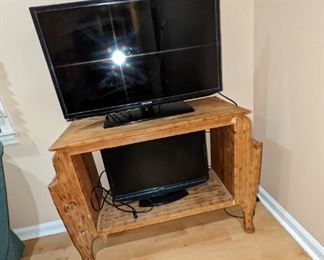 This is a really cool rustic piece custom made with magazine racks on each side. Perfect for a small TV.