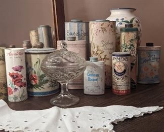 Antique tins for powder. My favorite is a dark green art deco tin.