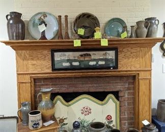 Oh my goodness! Pamela Owen on the mantle center. Orange glaze Jugtown. A collection of seagrove candle holders. Amazing fireplace screen. And just an exceptional collection of salt glazed Crocs and churns.