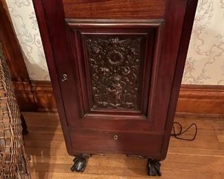 Antique Wood Cabinet with Carved Cherub Scene