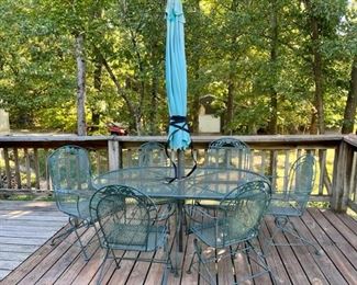 Wrought Iron Patio Furniture Set with six chairs and umbrella