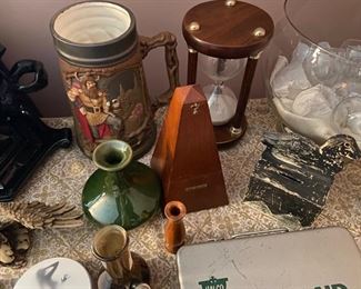 Seth Thomas metronome, primitive duck bank, big Oktoberfest stein, sand timer