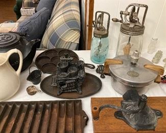 cast iron, Dazey churn, Buttercup one-quart churn, small pressure cooker, coffee grinder