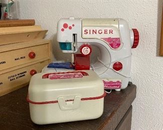 child's Singer sewing machine and sewing box