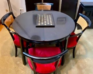 Gorgeous Mid-Century Modern Dining Table with 4 Chairs. This table has 3 Leaves with 4 Red Velvet Seat Cane Back Armed Chairs. Very Cool Retro Look