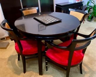 Gorgeous Mid-Century Modern Dining Table with 4 Chairs. This table has 3 Leaves with 4 Red Velvet Seat Cane Back Armed Chairs. Very Cool Retro Look