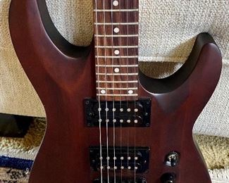 Beautiful Schecter Diamond Series Electric Guitar. Color: Walnut with Maple, Rose Wood and Basswood
Neck is Maple with a Solid body Electric Guitar,
2 Humbucking Pickups,  Rosewood Fingerboard.  Includes a custom case made for this guitar.