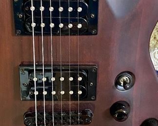 Beautiful Schecter Diamond Series Electric Guitar. Color: Walnut with Maple, Rose Wood and Basswood
Neck is Maple with a Solid body Electric Guitar,
2 Humbucking Pickups,  Rosewood Fingerboard.  Includes a custom case made for this guitar.