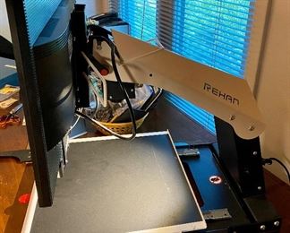 This is a Rehan I-See HD Magnifier for Macular Degeneration Sufferers.  The Machine digitizes the image on the tray (Books, Magazines, Newspapers, etc) The monitor is a 22" Acer Monitor and I-See Software.