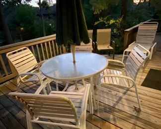 Round glass patio table with 4 matching Chairs and Chaise Lounge. We have the umbrella and base included. 