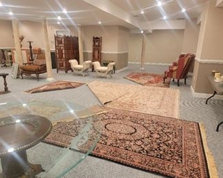 There are carpets available. the ones that have corners folded over are not for sale