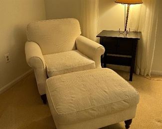 Upholstered armchair with matching ottoman by Chateau D'ax furniture with 2 shelved end table