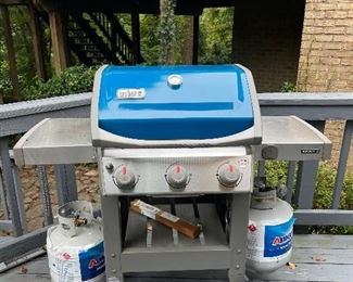 Weber Spirit II blue-hooded propane gas grill