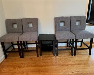 4 upholstered counter-height chairs with black 2 shelf occasional table