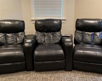 Set of three ebony leather home theater recliners. 