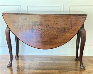 Antique English Queen Anne Gateleg Drop Leaf Table with Slipper Foot. Measures, when closed, 41" W x 15.5" D x 28" H.  With both leaves extended, oval table measures 75" W. Photo 2 of 4. 