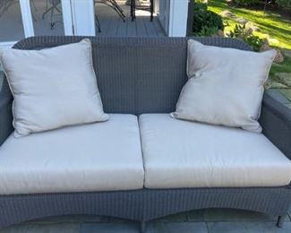 All-Weather Wicker Loveseat with Sunbrella Cushions. Photo 1 of 2. 