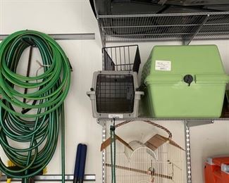 Assorted hoses and Dog Carriers. 