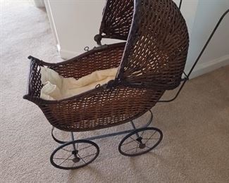 Antique wicker doll stroller 