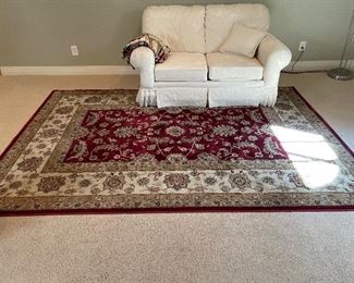Rug and loveseat 