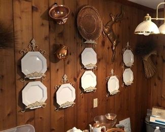 Lots of mid century copper decor and plates in racks