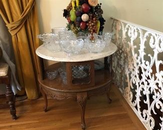 Marble top French Provincial table loaded with crystal