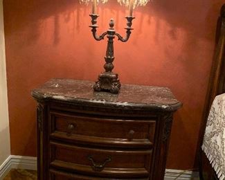 Marble top side table included with bedroom set