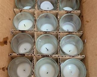 There are HUNDREDS of these....clear and/or red glass, some unused (not all have candles in them)