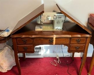 White sewing machine with cabinet (and sewing supplies)