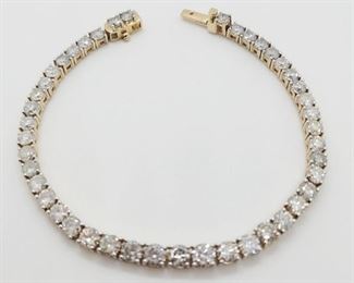 2z - 14kt Gold Diamond Bracelet 44 genuine round diamonds weighing approx 10.52 carats. Measures 7.25" and is finished w/ a tension lock clasp & safety clasp. Total weight is 13.6 grams
