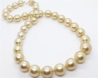 8z - Rare Golden South Sea Pearl Necklace The strand has each pearl individually hand knotted and measures 18" in length. Finished with 14k yellow gold plunger style tension lock scalloped bead clasp.