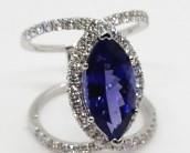 14z - 18kt White Gold Tanzanite & Diamond Ring size 7 The featured Tanzanite is set within a diamond bezel Total weight of Colored Stone 5.24ct, total weight of diamonds .95ct